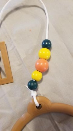 Pull String orange yellow green beads close up